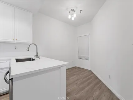 a utility room with a sink dryer and washer