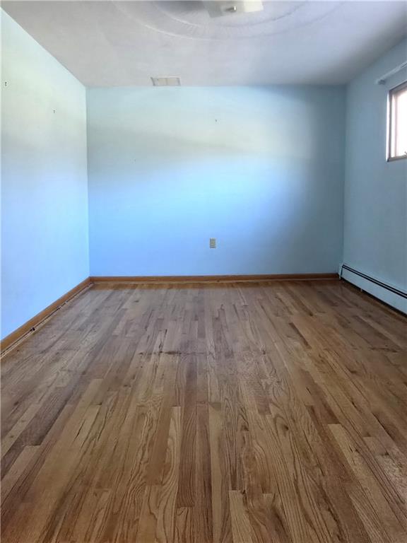 770 Pittsburgh Road Butler, PA 16002 - Photo 15 of 32 a view of an empty room with wooden floor and a window