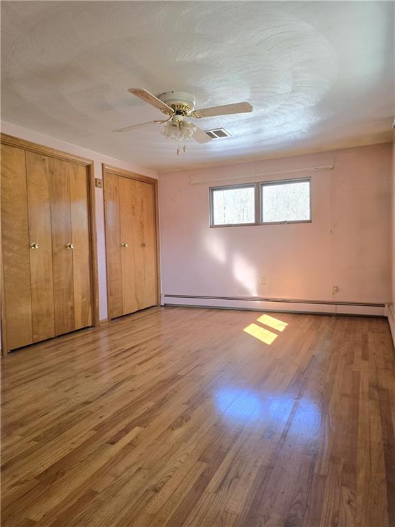 770 Pittsburgh Road Butler, PA 16002 - Photo 18 of 32 a view of empty room with wooden floor and fan