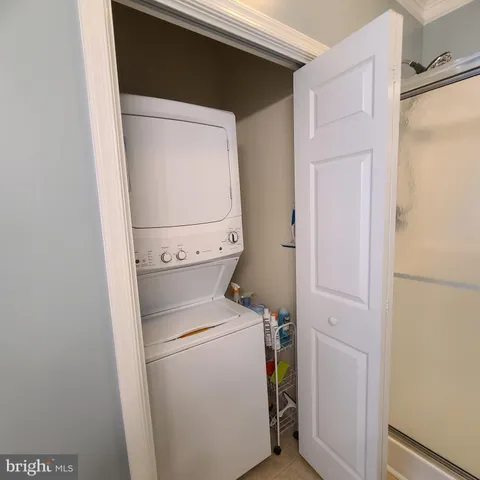 a bed room with a bed and a flat tv screen