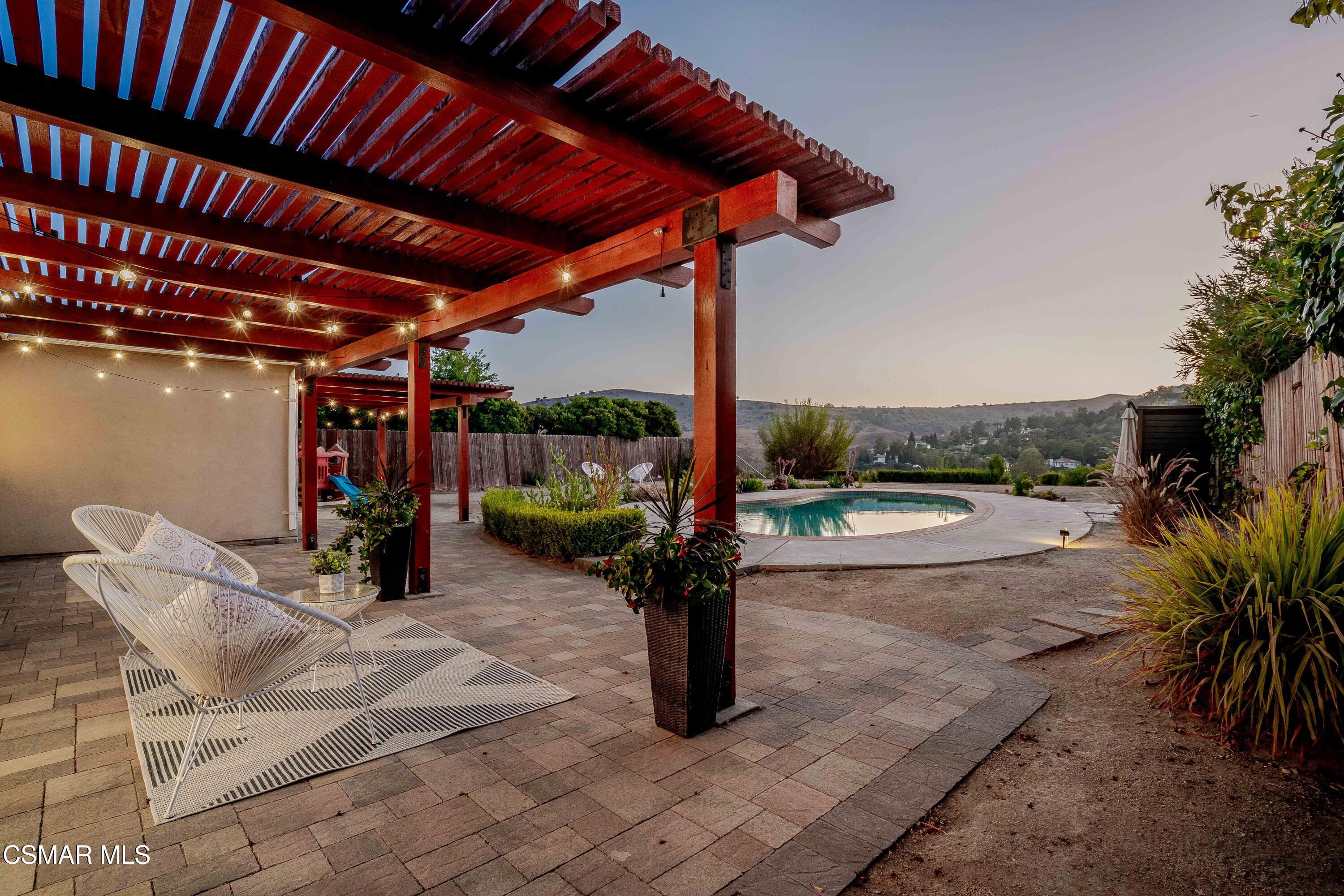 a view of swimming pool with outdoor seating