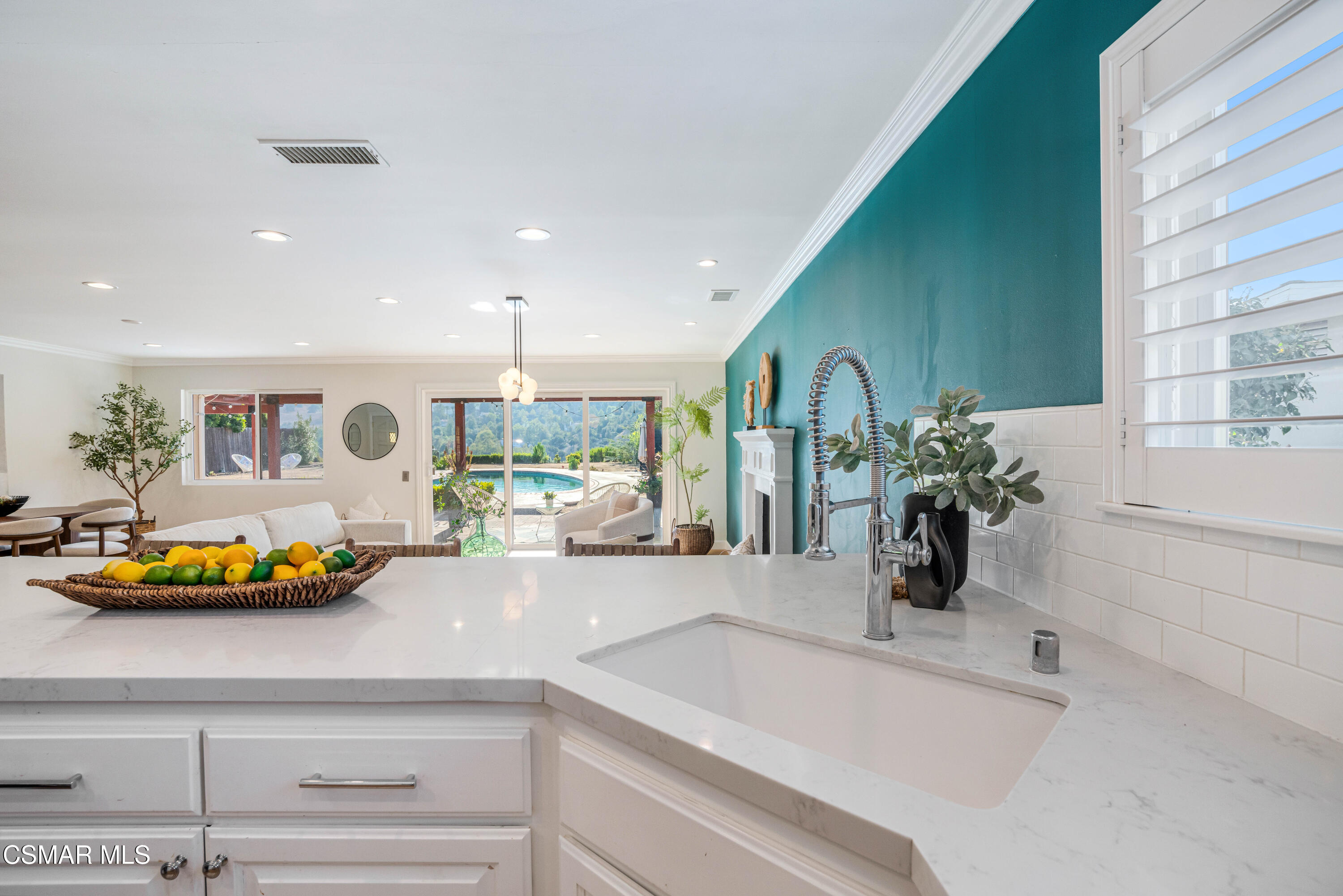 5839 Parkmor Road Calabasas, CA 91302 - Photo 14 of 42 a kitchen with a sink and potted plant