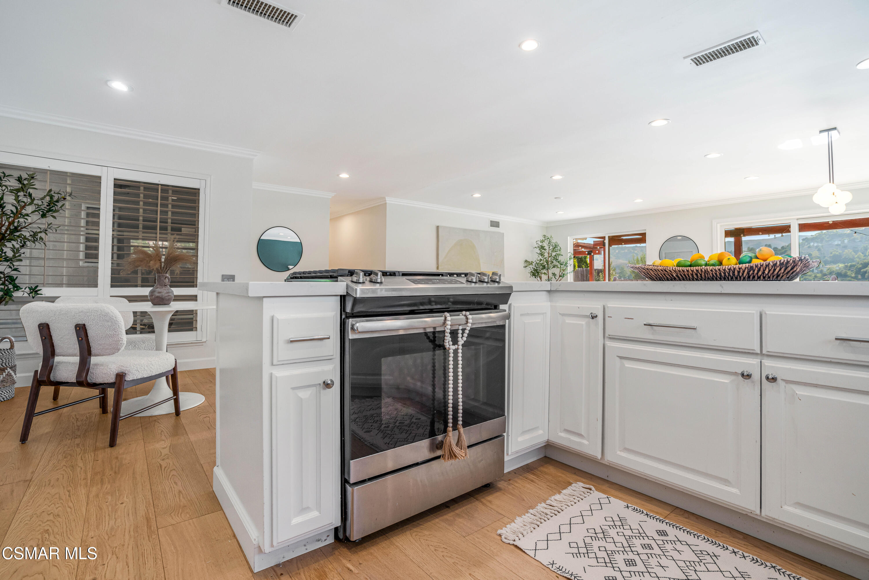5839 Parkmor Road Calabasas, CA 91302 - Photo 15 of 42 a kitchen with stainless steel appliances granite countertop a stove a sink and a microwave
