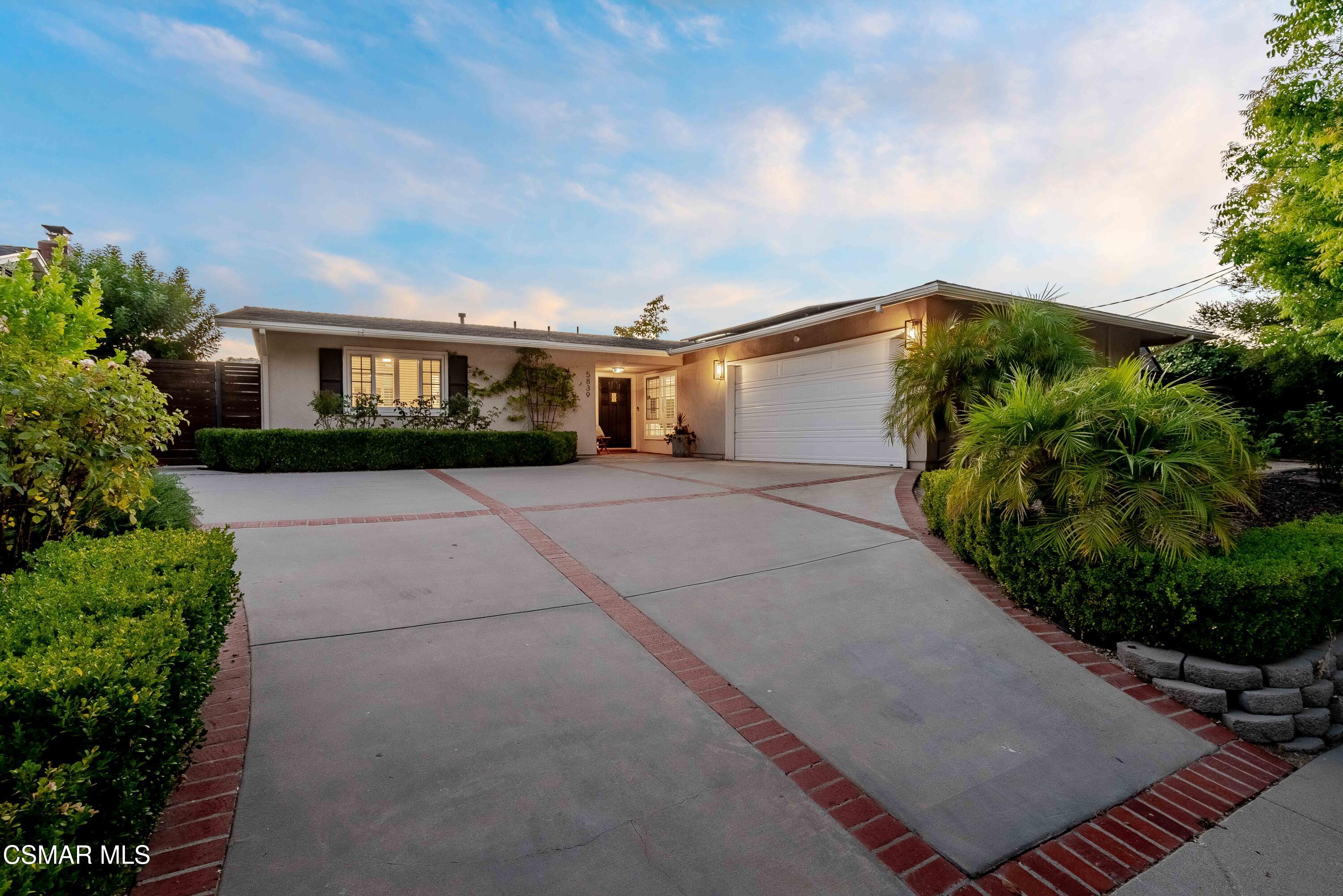 5839 Parkmor Road Calabasas, CA 91302 - Photo 2 of 42 a backyard of a house with plants and trees