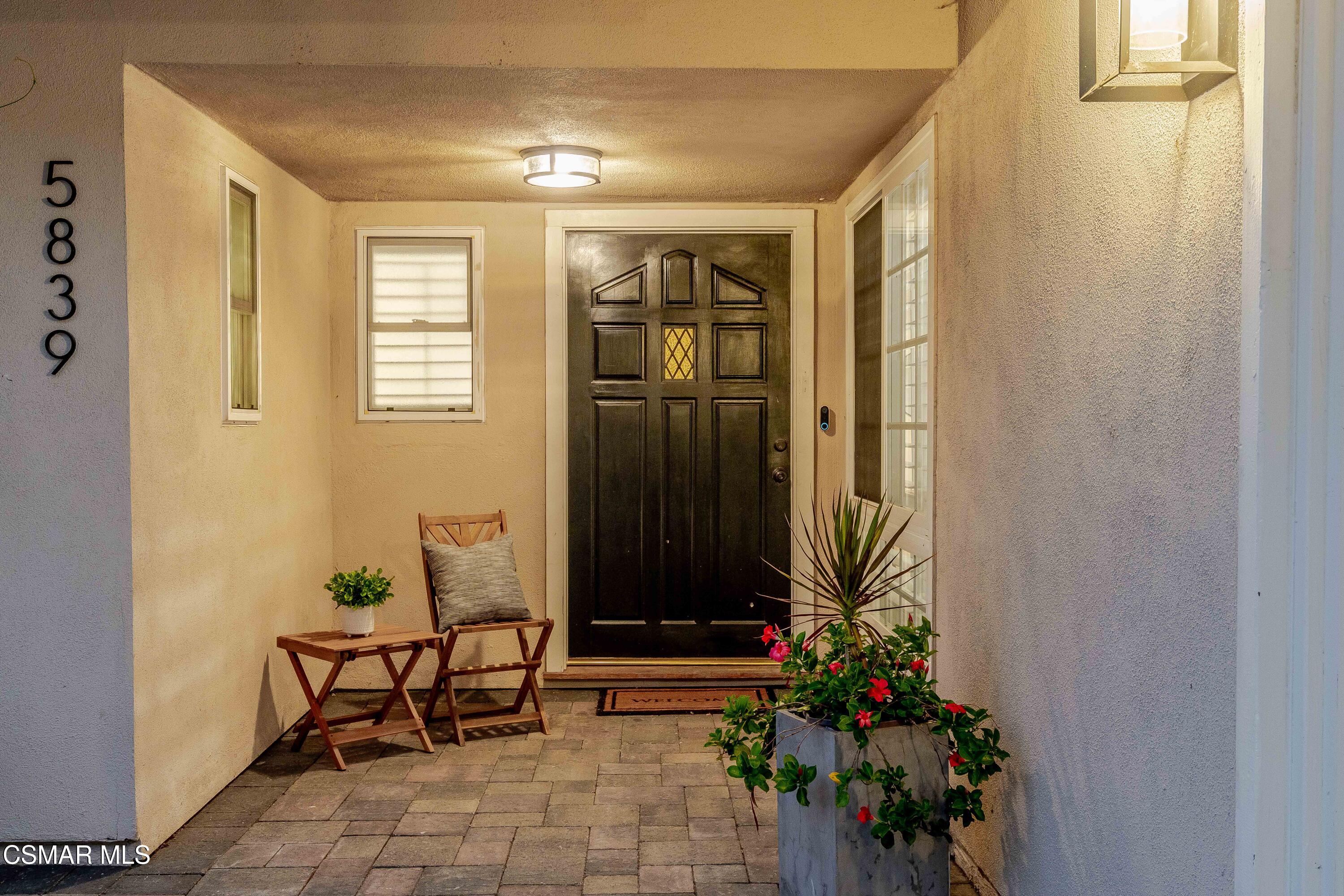 5839 Parkmor Road Calabasas, CA 91302 - Photo 3 of 42 a living room with furniture and a potted plant