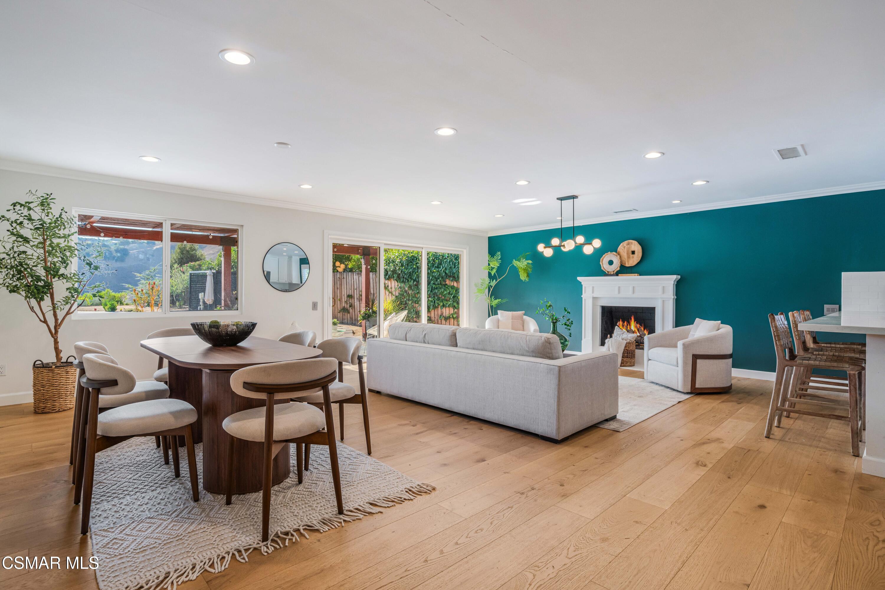 5839 Parkmor Road Calabasas, CA 91302 - Photo 4 of 42 a living room with fireplace furniture and a wooden floor