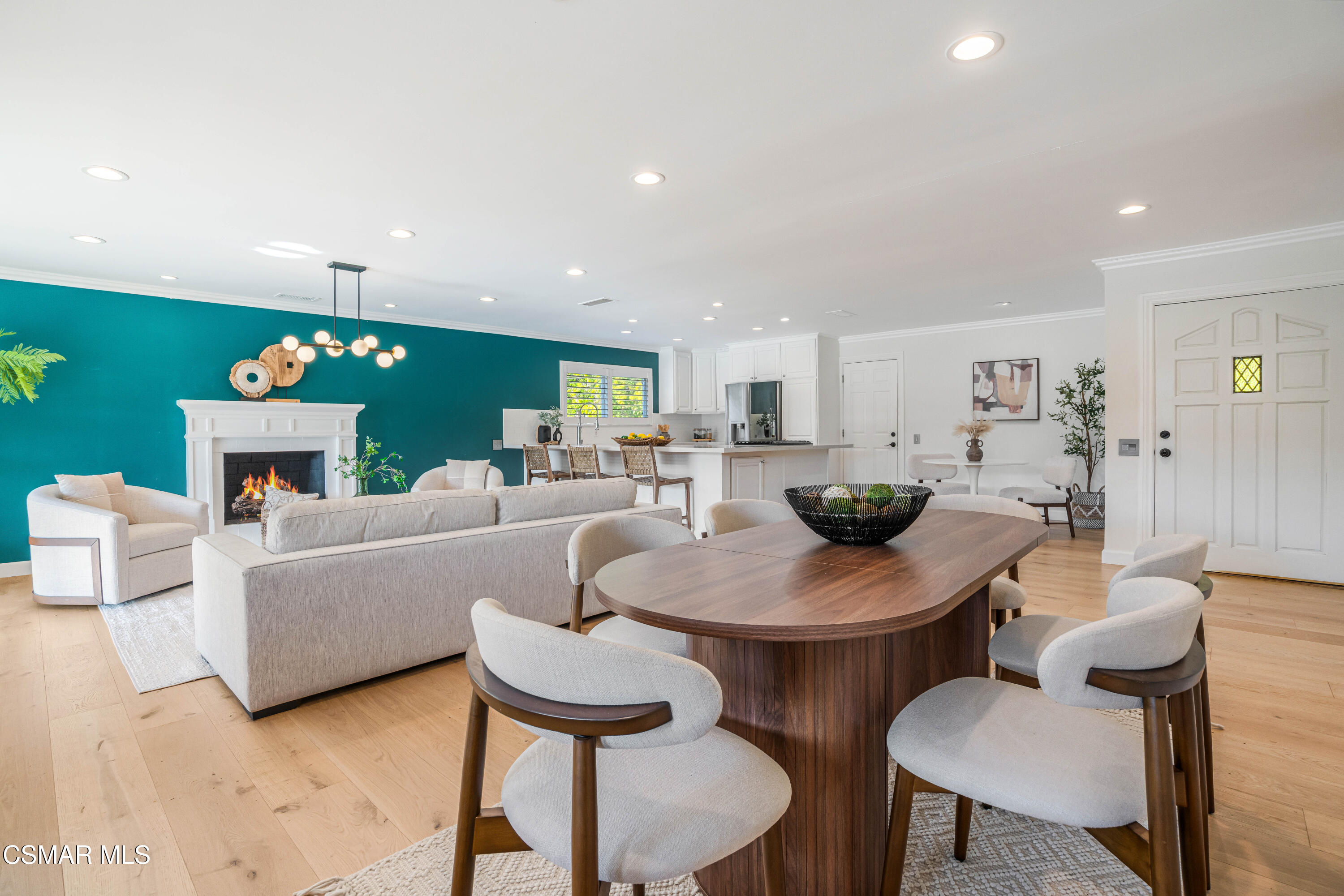5839 Parkmor Road Calabasas, CA 91302 - Photo 5 of 42 a living room with furniture a dining table and kitchen view
