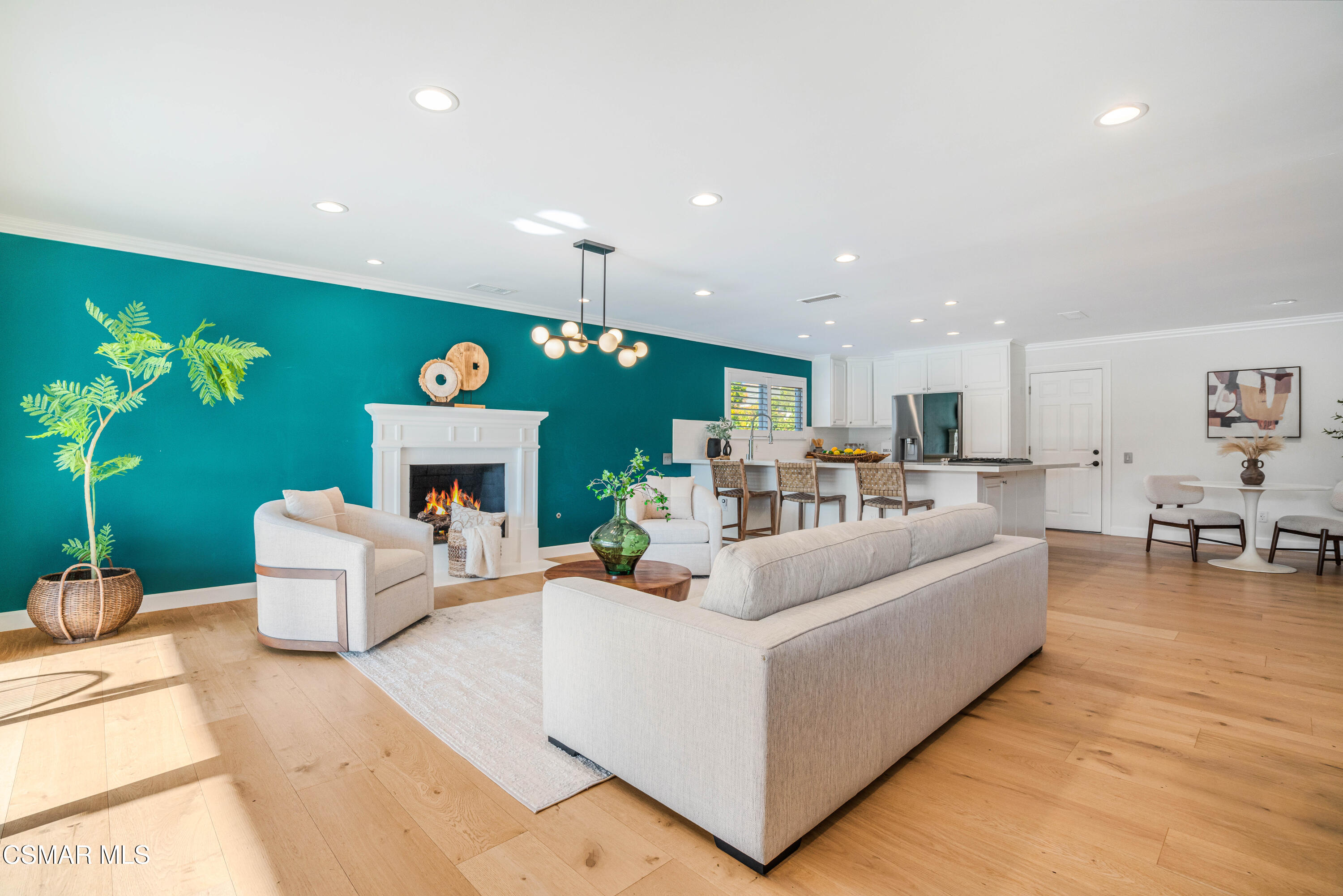 5839 Parkmor Road Calabasas, CA 91302 - Photo 7 of 42 a living room with furniture kitchen view and a chandelier