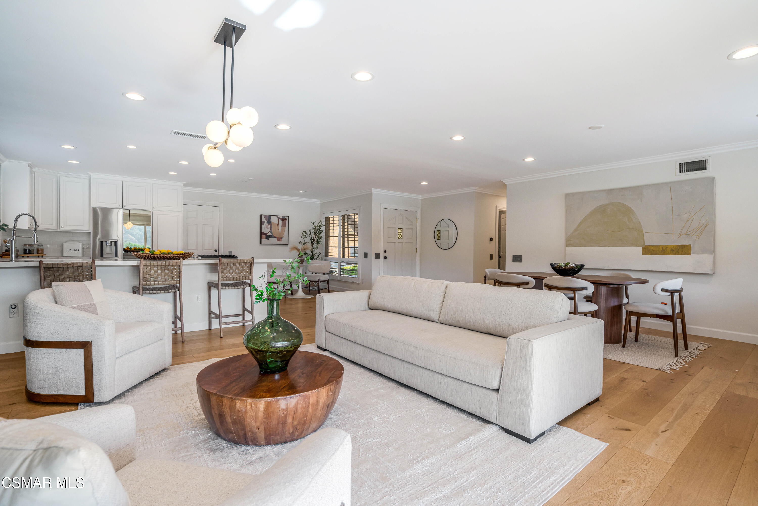 5839 Parkmor Road Calabasas, CA 91302 - Photo 8 of 42 a living room with furniture kitchen view and a chandelier