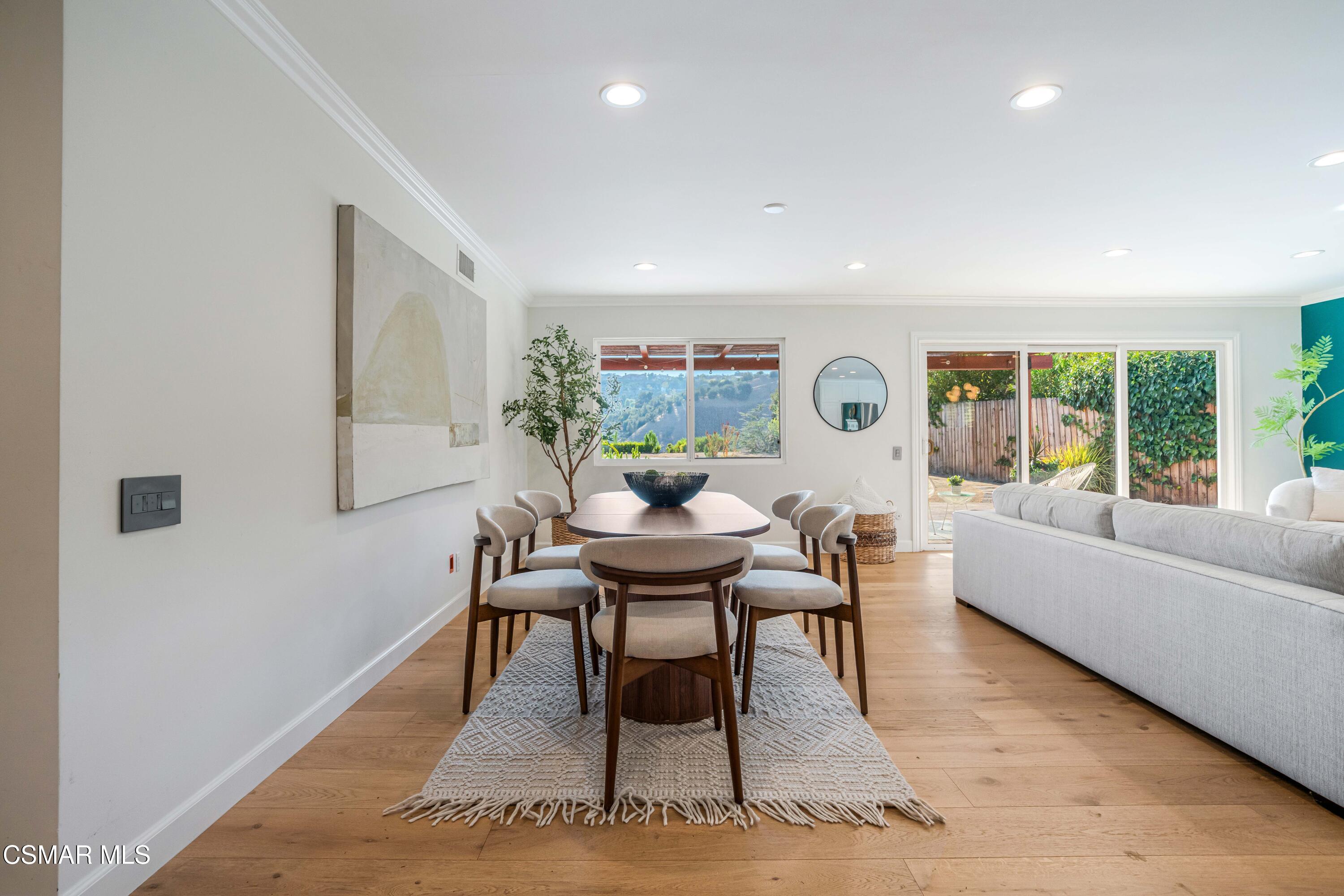5839 Parkmor Road Calabasas, CA 91302 - Photo 10 of 42 a living room with furniture and a large window