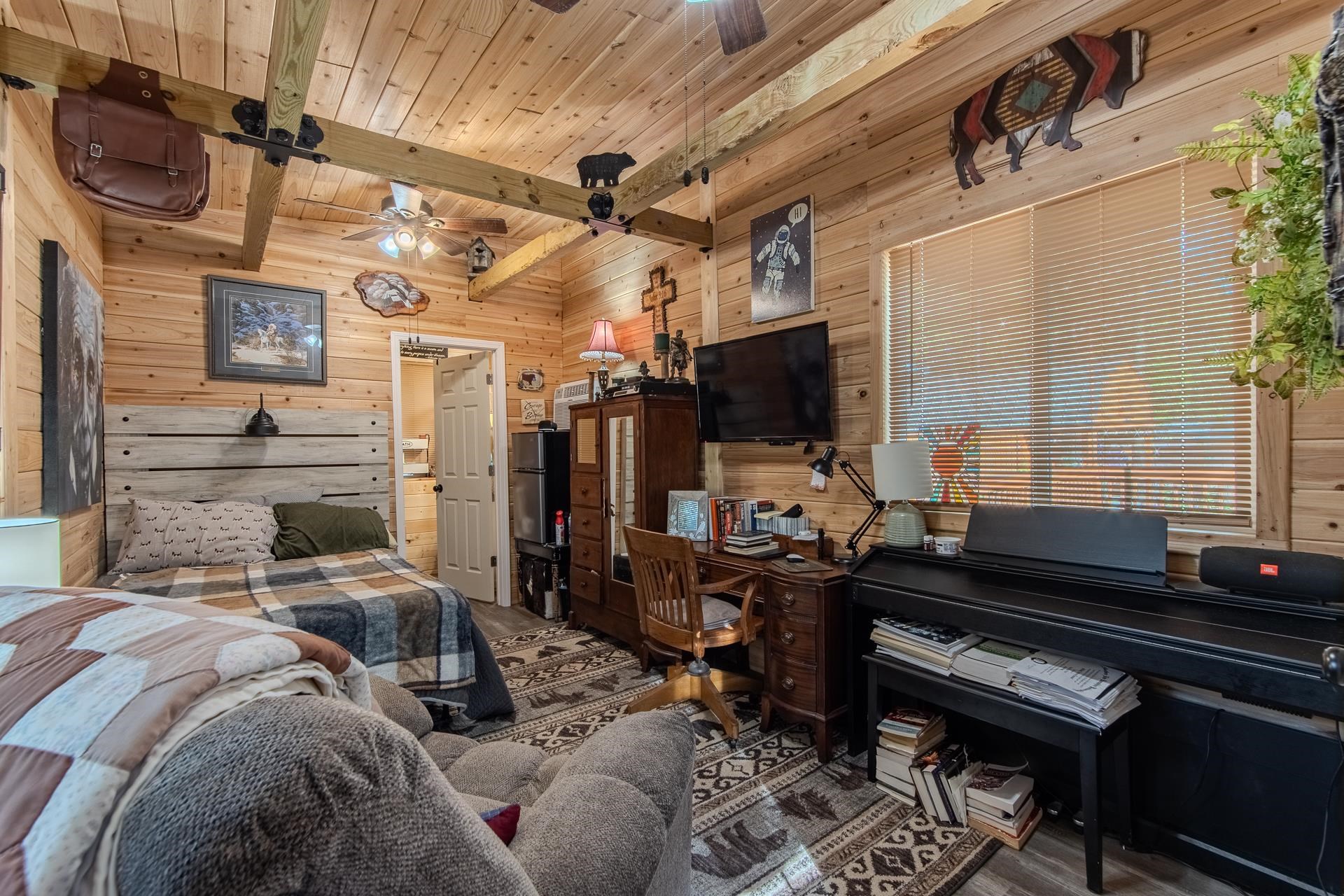 225 Lew Wallace Road Crump, TN 38327 - Photo 22 of 40 a bedroom with furniture and a window