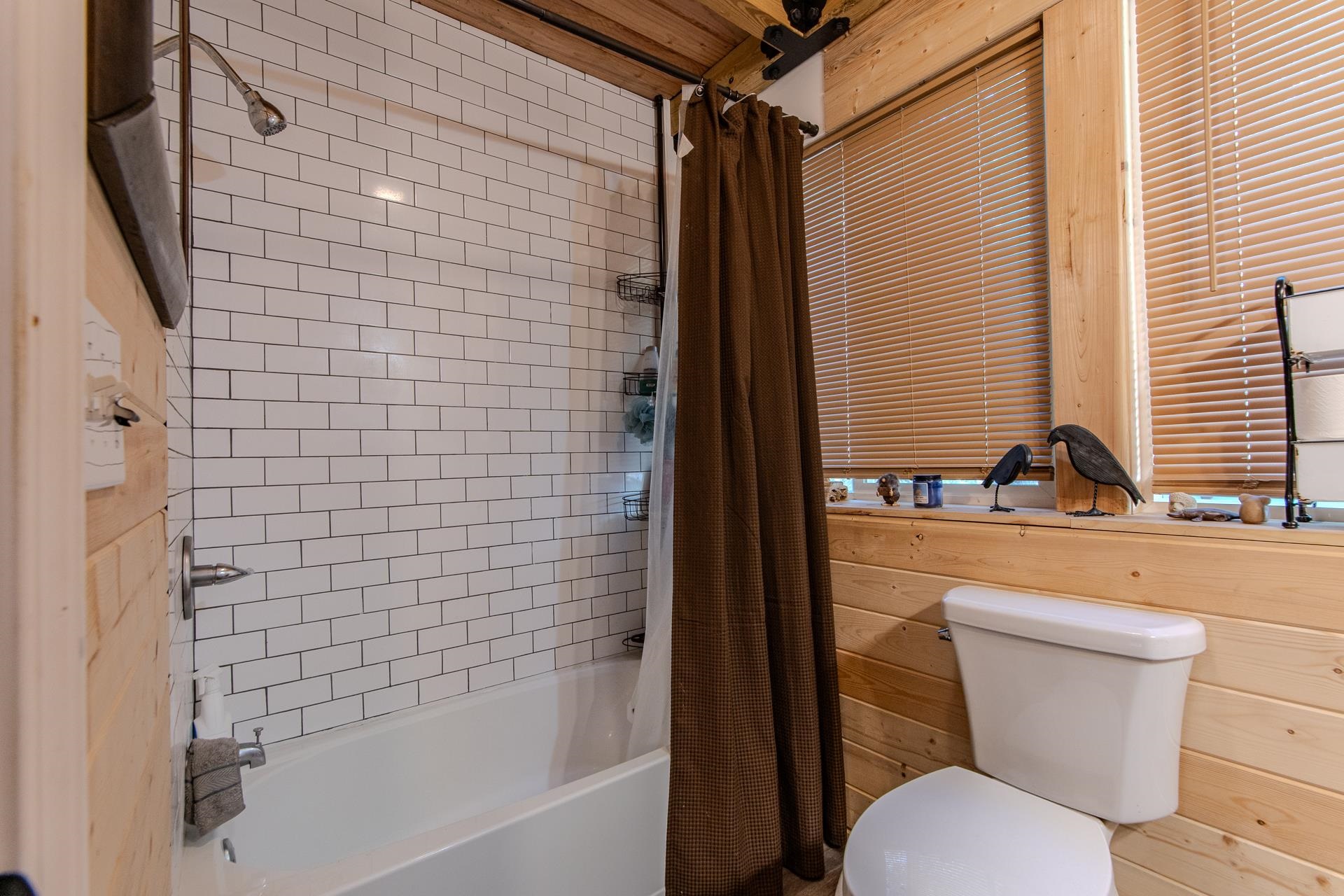 225 Lew Wallace Road Crump, TN 38327 - Photo 24 of 40 a bathroom with a toilet sink and shower