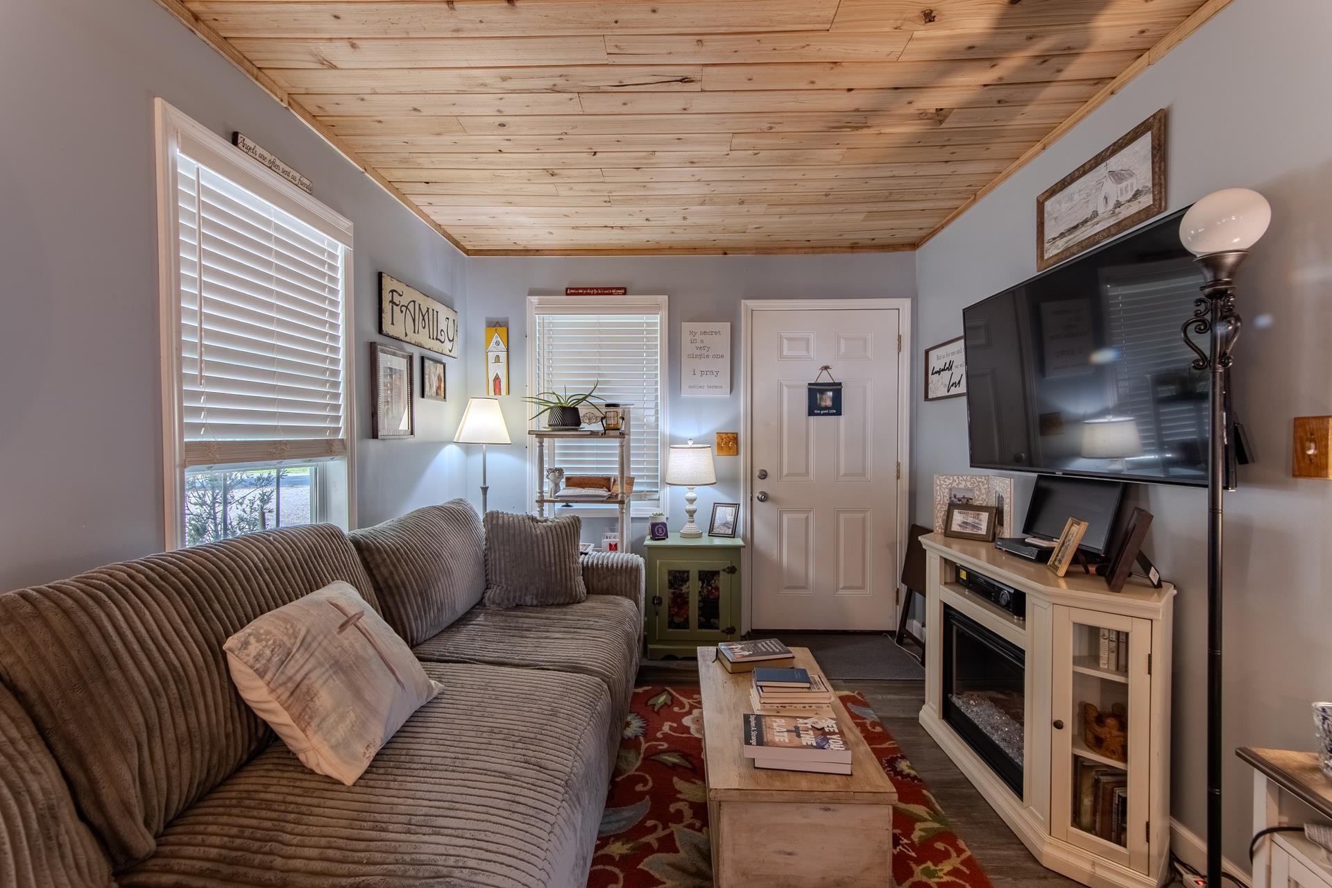 225 Lew Wallace Road Crump, TN 38327 - Photo 8 of 40 a living room with furniture and a flat screen tv