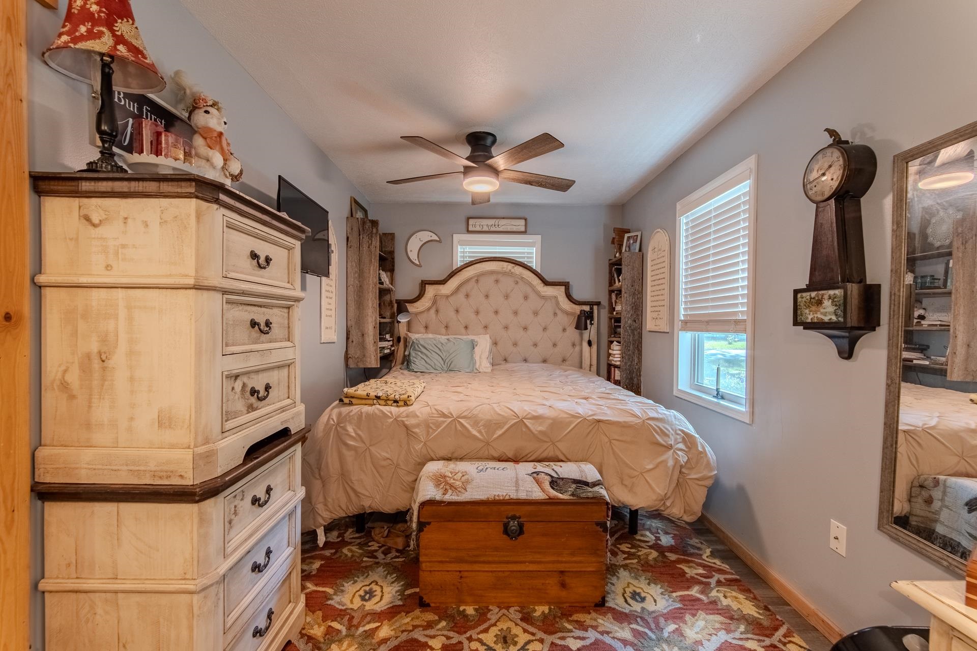225 Lew Wallace Road Crump, TN 38327 - Photo 10 of 40 a bedroom with a bed and a chandelier