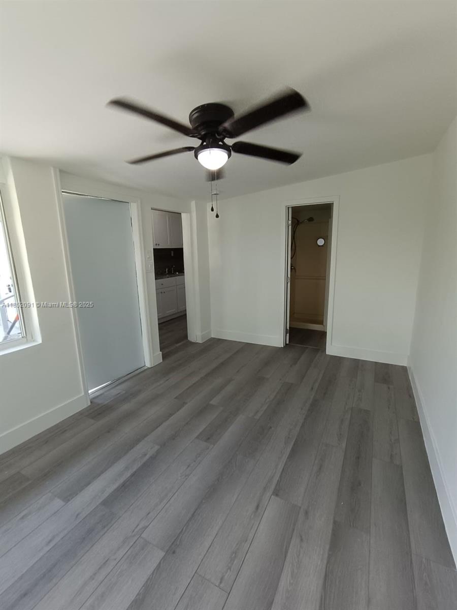 1857 Southwest 4th Street, Unit 3 Miami, FL 33135 - Photo 8 of 10 wooden floor in an empty room with a window