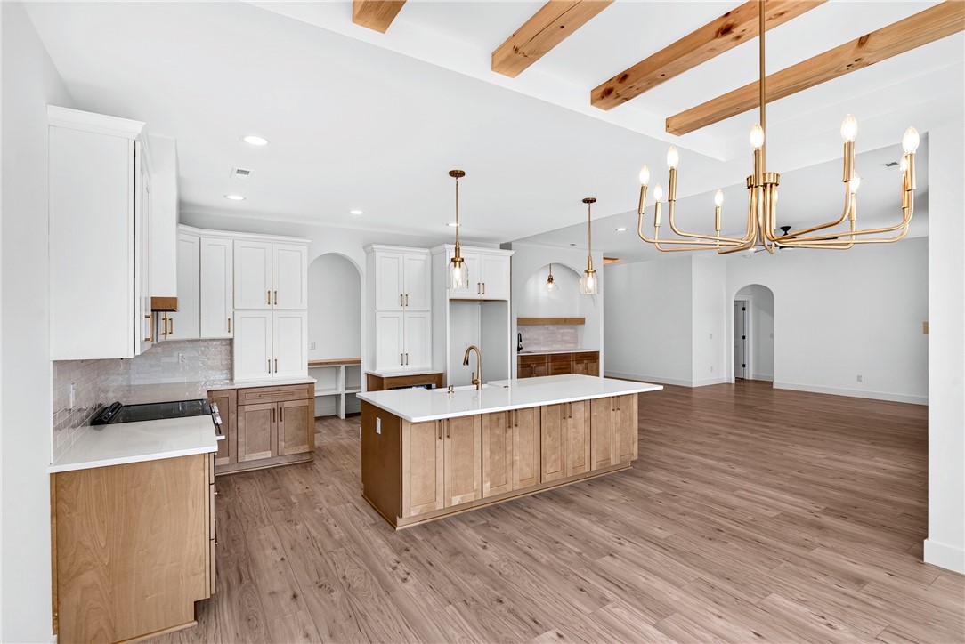 416 Blume Road Anderson, SC 29625 - Photo 11 of 29 A grand central island anchors this pristine kitchen with warm wood beams overhead.