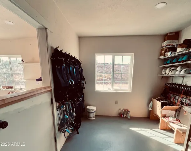 a room with furniture and musical instruments