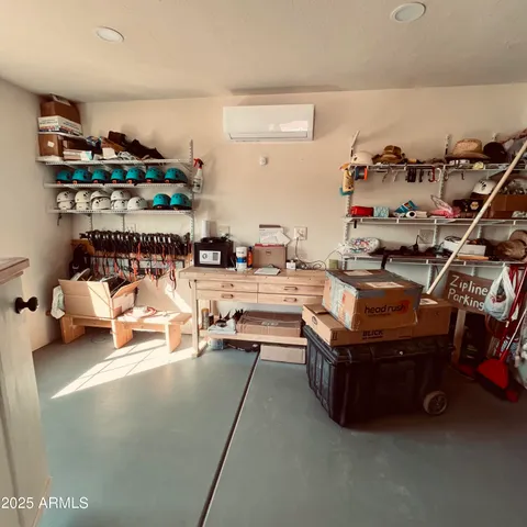 a view of a room with lots of furniture and clutter