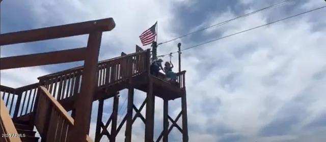 a view of staircase with wooden floor and windows