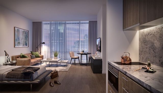 a living room with furniture and large windows