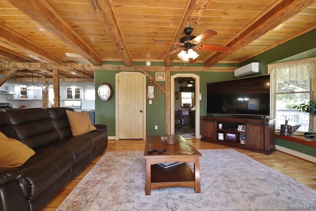 575 Roosa Gap Road Bloomingburg, NY 12721 - Photo 15 of 50 a living room with furniture and a flat screen tv