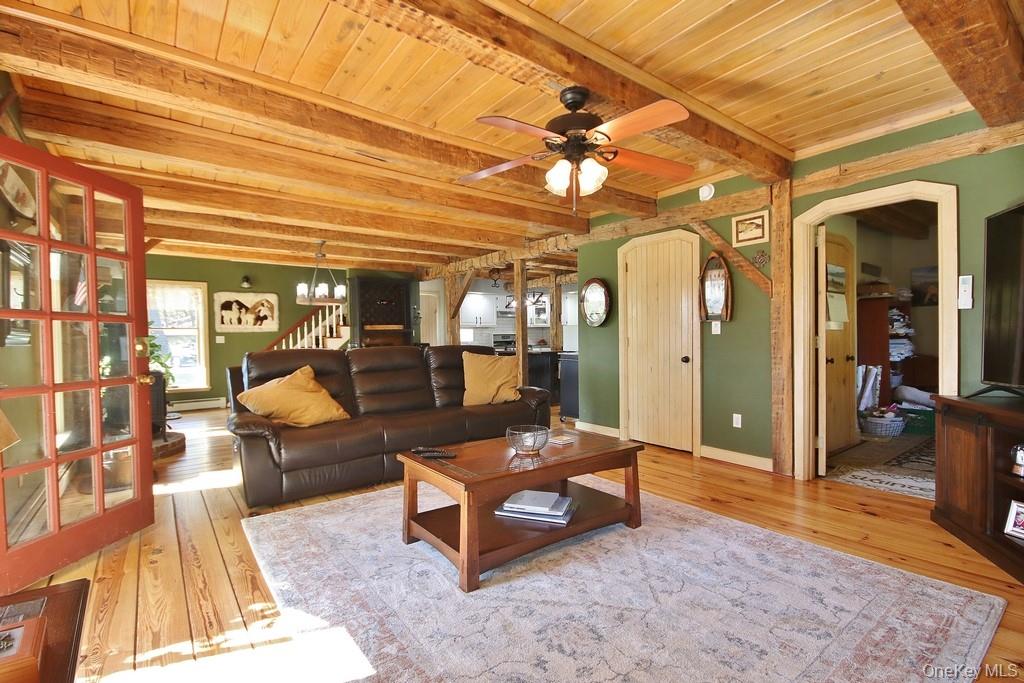 575 Roosa Gap Road Bloomingburg, NY 12721 - Photo 16 of 50 a living room with furniture and a chandelier