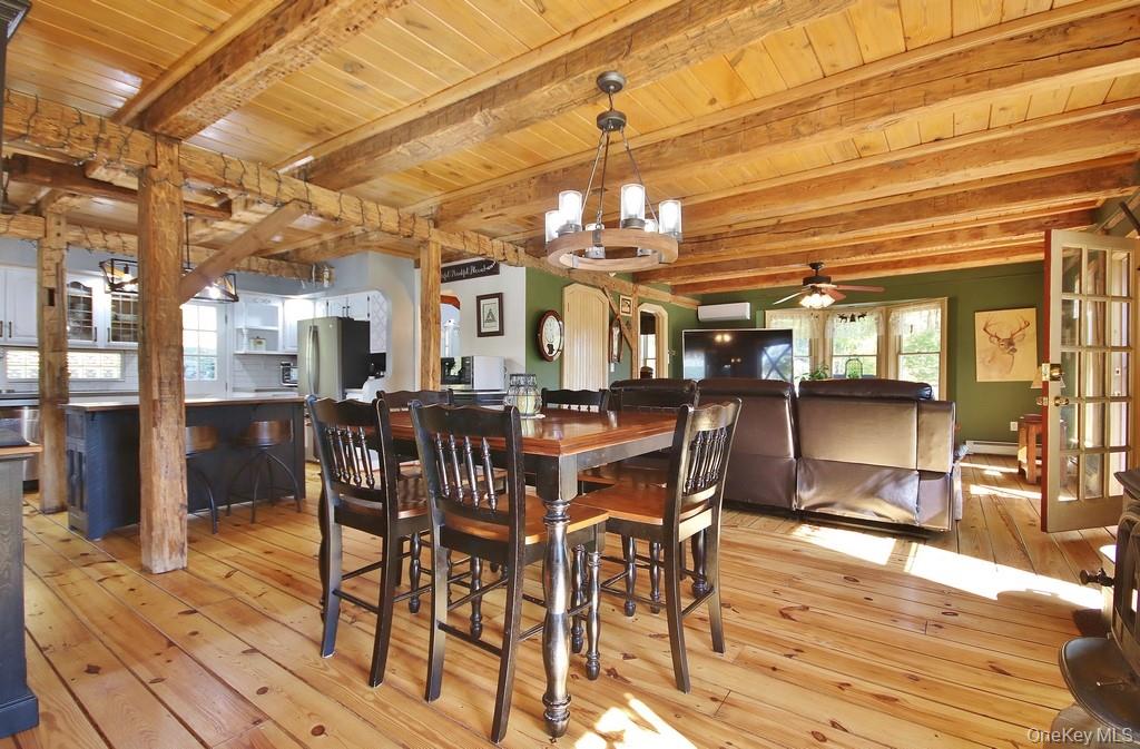 575 Roosa Gap Road Bloomingburg, NY 12721 - Photo 19 of 50 a view of a dining room with furniture and wooden floor