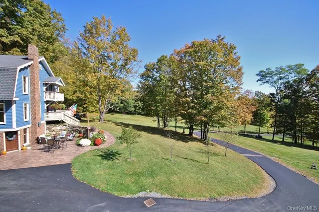a view of a swimming pool with a sitting area