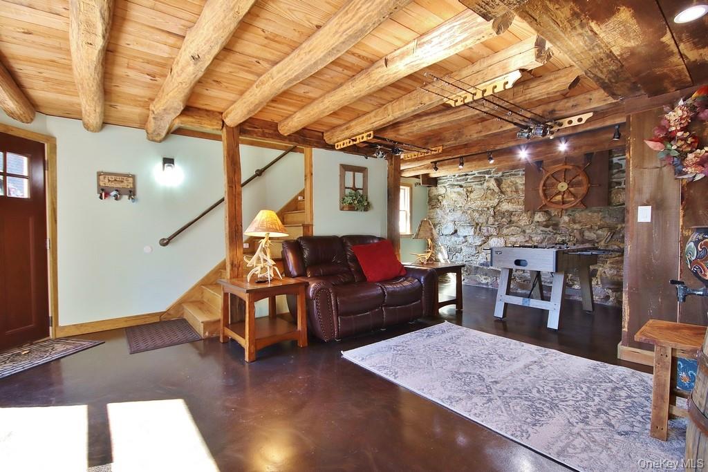 575 Roosa Gap Road Bloomingburg, NY 12721 - Photo 37 of 50 a living room with furniture and wooden floor