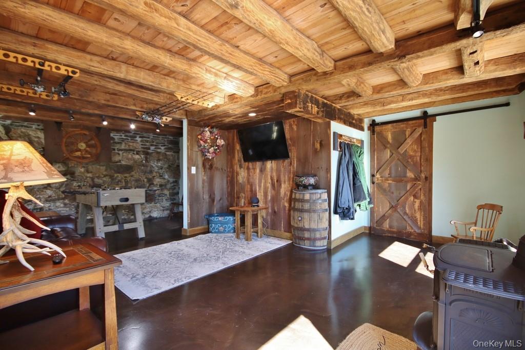 575 Roosa Gap Road Bloomingburg, NY 12721 - Photo 40 of 50 a view of a room with furniture and wooden floor
