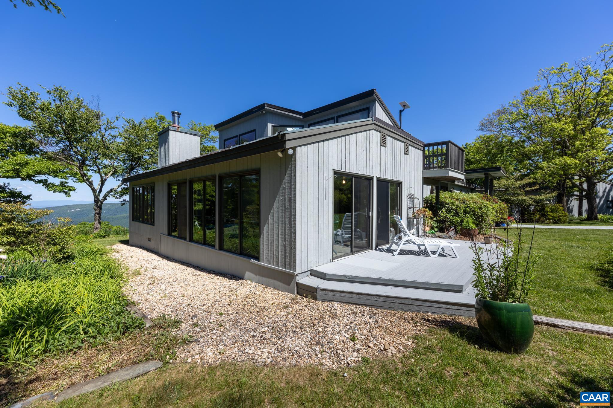 7098 Bucks Elbow Mountain Road Crozet, VA 22932 - Photo 51 of 57 a front view of a house with a yard
