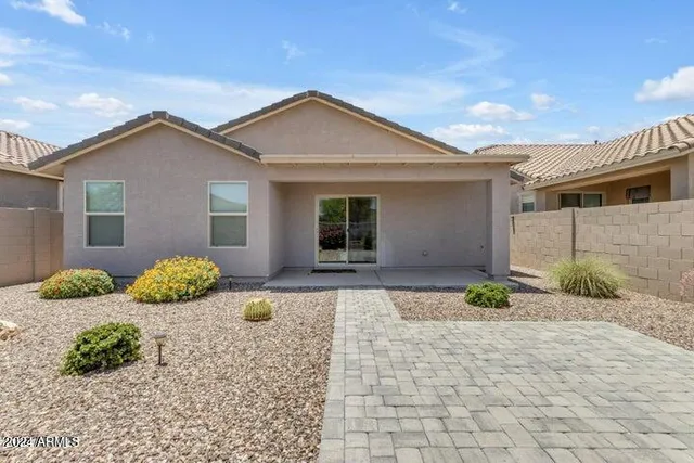 a view of a balcony with wooden benches