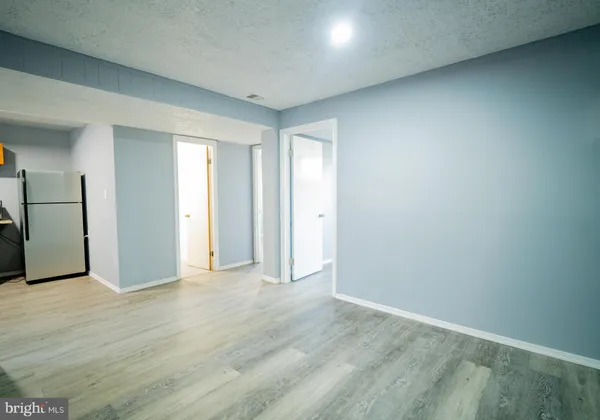 a view of livingroom with an empty space and a window