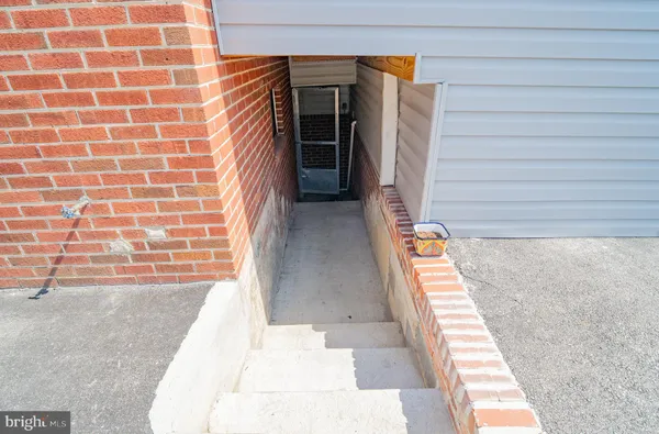 a view of a patio with dining table and chairs with wooden floor and fence