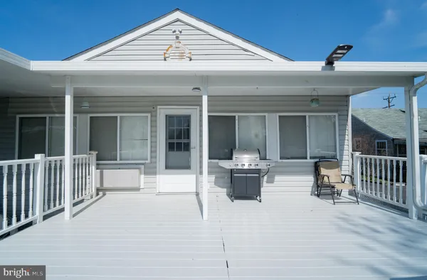a view of a patio with a yard