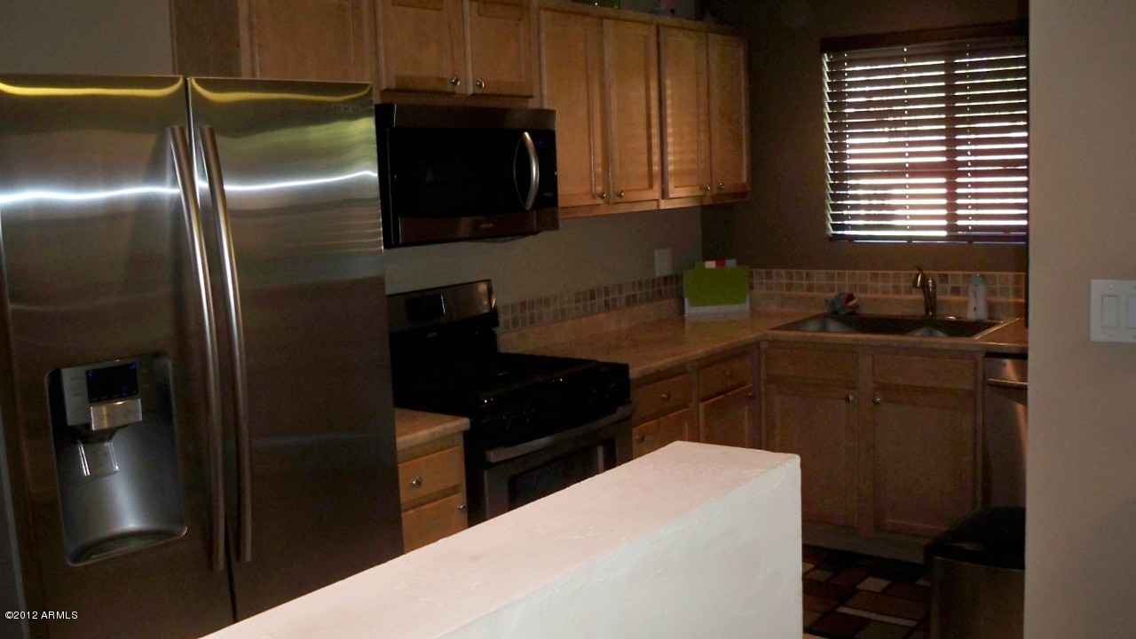 1142 East Lamar Road Phoenix, AZ 85014 - Photo 7 of 10 KITCHEN VIEW FROM DINING AREA