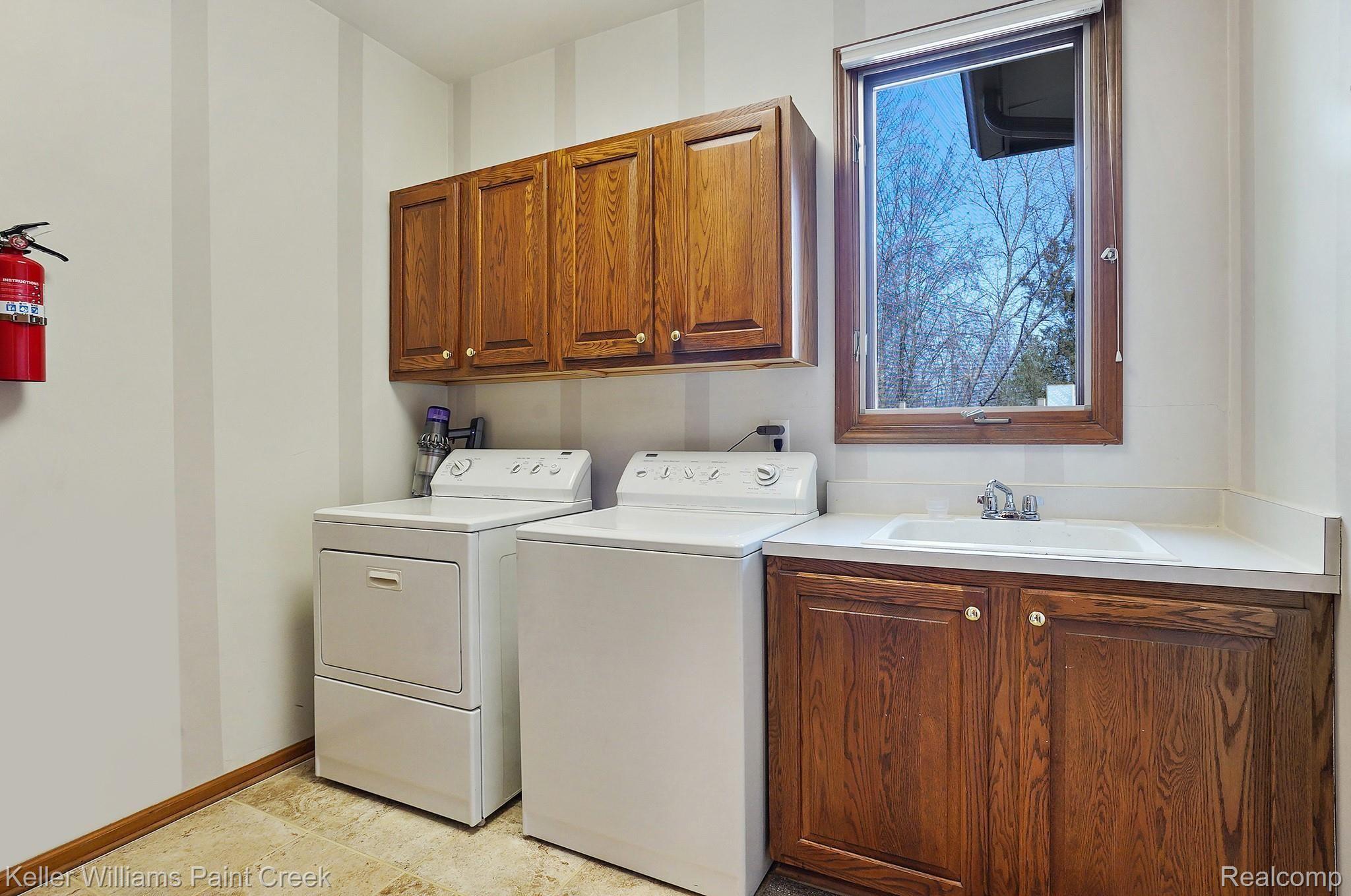 3599 Vineyard Springs Court Rochester, MI 48306 - Photo 43 of 62 Large Laundry Room is also full of storage space