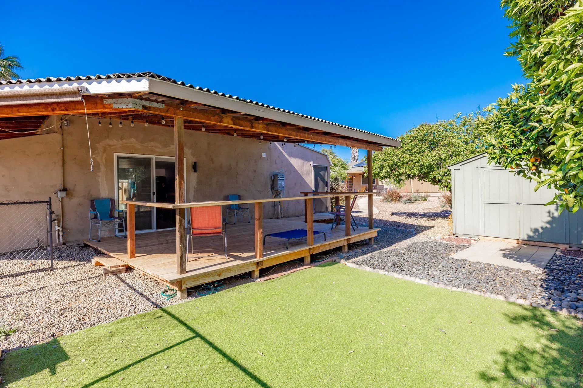 28436 Sunset Road Valley Center, CA 92082 - Photo 26 of 36 a view of a backyard with a large tree and wooden fence