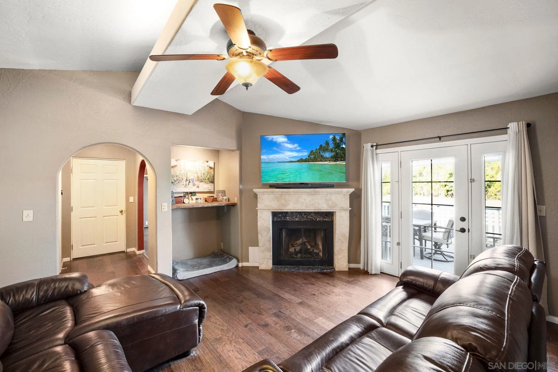 28436 Sunset Road Valley Center, CA 92082 - Photo 8 of 36 a living room with furniture and a fireplace