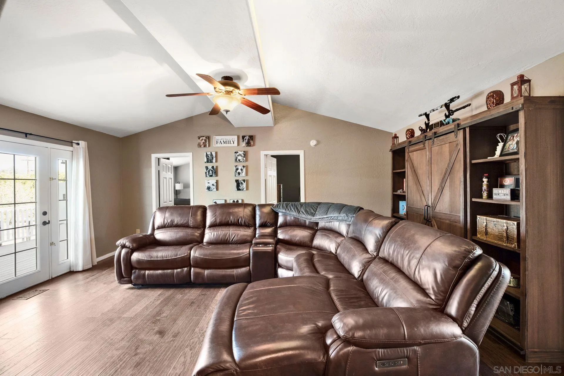 28436 Sunset Road Valley Center, CA 92082 - Photo 9 of 36 a living room with furniture a ceiling fan and a window