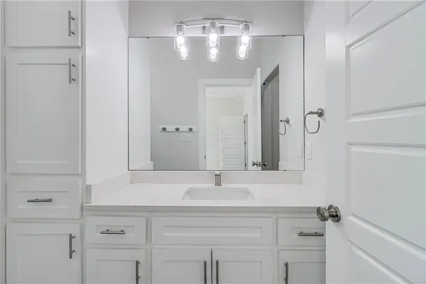 a bathroom with a toilet a sink and bathtub