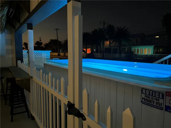 a view of a house with backyard and deck
