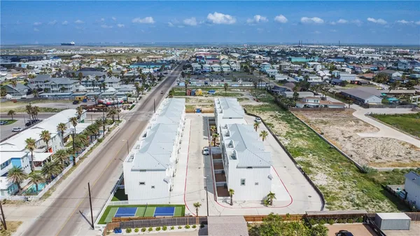 an aerial view of residential houses with outdoor space