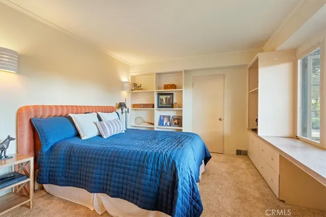 a front view of a house with swimming pool having outdoor seating