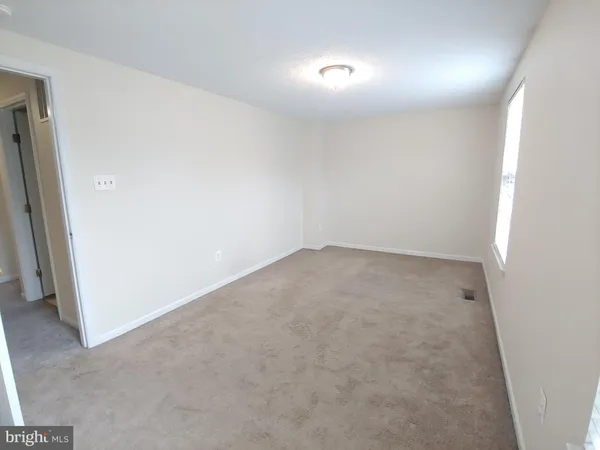 an empty room with a hallway