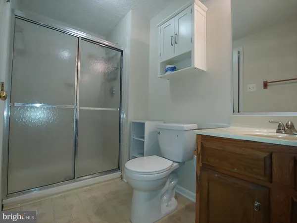 a bathroom with a toilet sink and shower