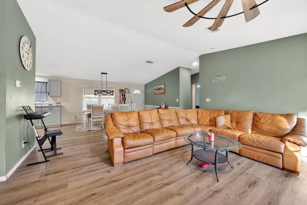 40100 Jim Scotts Road Leesburg, FL 34788 - Photo 11 of 40 a living room with furniture and wooden floor