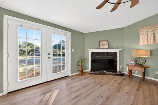 a living room with furniture and a fireplace