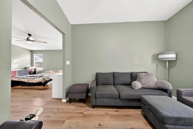 a living room with furniture and a table