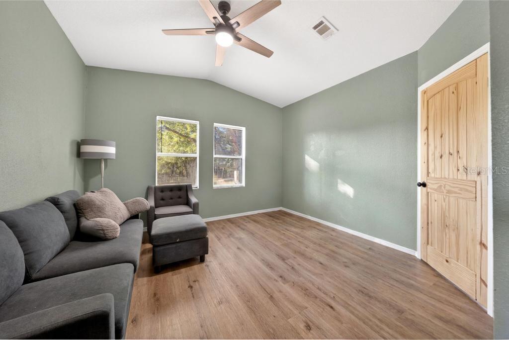 40100 Jim Scotts Road Leesburg, FL 34788 - Photo 24 of 40 a living room with furniture and a window